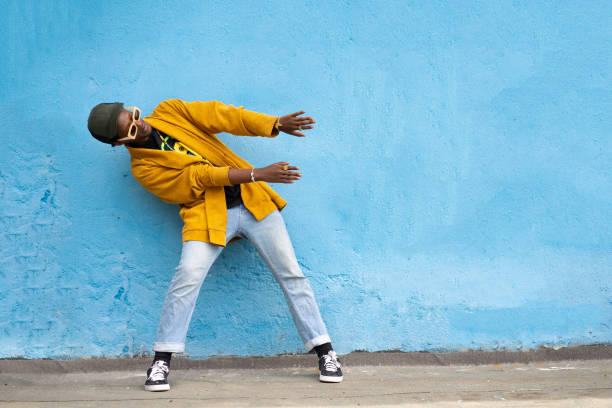 istock A young guy in casual clothes posing with arms out to one side 1731264420
