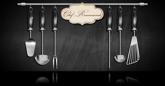 Set of kitchen utensils made of stainless steel and black plastic on a blackboard with copy space and a label with text Chef Recommends. 3D illustration. Template of a restaurant menu.