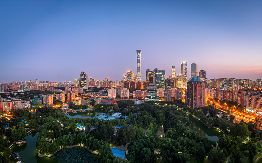 The skyline of Beijing at sunset, beautiful and fresh urban environment, and green vegetation.