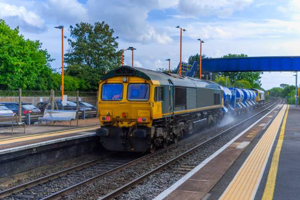 istock A freightliner locomotive is pulling a goods / freight train with containers. 1731276980