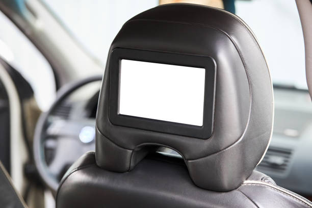 istock Car inside headrest screen mock up. Interior of prestige luxury modern car. One white display for back seats passenger with copy space and place for text. 1731279716