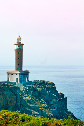 Punta Nariga Lighthouse, rock formation and seascape. Malpica de Bergantiños, Rías Altas, A Coruña, Spain