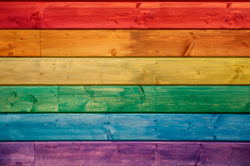 Pride flag with wooden background