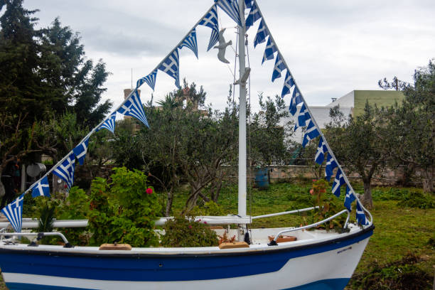 Sant Antony de Portmany, Ibiza, Balearic Islands - August 28, 2014 :  Boat in a garden in Sant Antony de Portmany