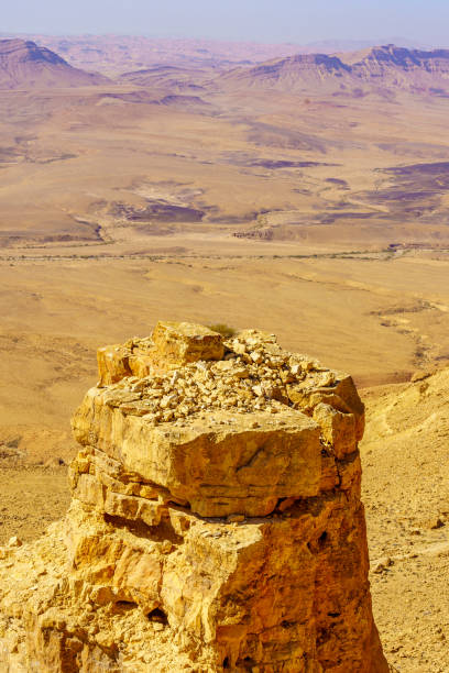 istock Cliff edge of Makhtesh (crater) Ramon, in the Negev Desert 1731303592
