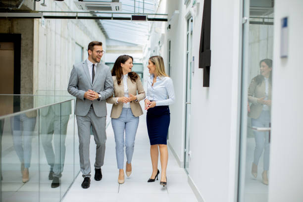 istock Young startup team have a discussion while walking in the modern office corridor 1731308544