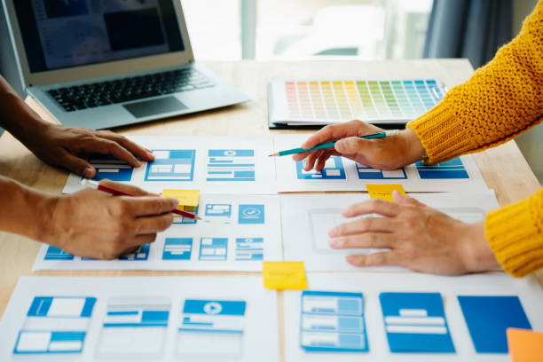 istock View of UI developer team brainstorming on their project with laptop, smartphone and digital tablet. Creative digital development agency. 1731320164