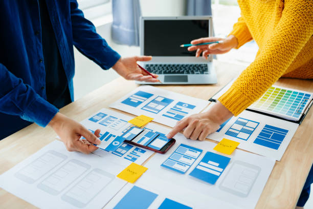 istock View of UI developer team brainstorming on their project with laptop, smartphone and digital tablet. Creative digital development agency. 1731320172