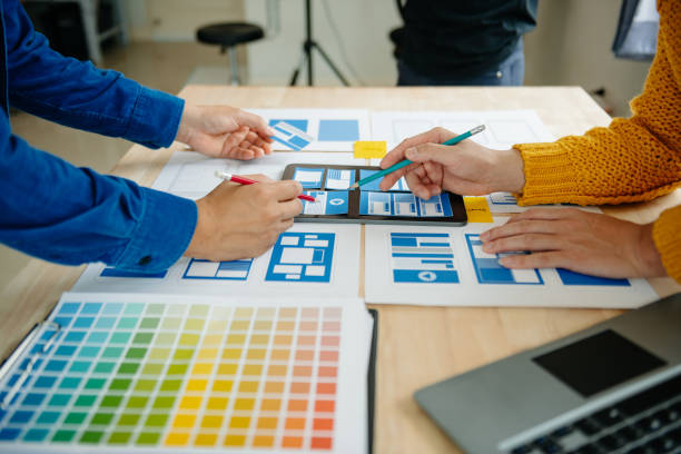 istock View of UI developer team brainstorming on their project with laptop, smartphone and digital tablet. Creative digital development agency. 1731320174