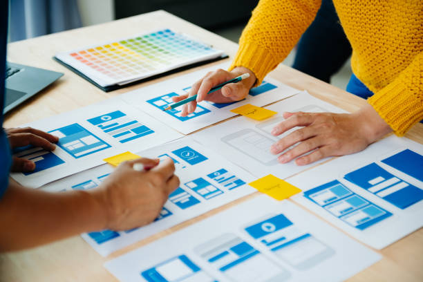 istock View of UI developer team brainstorming on their project with laptop, smartphone and digital tablet. Creative digital development agency. 1731320177