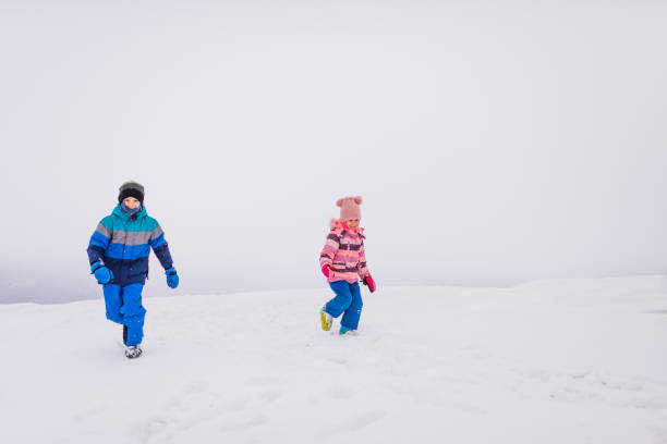 istock Happy kids enjoying winter snow 1731320763