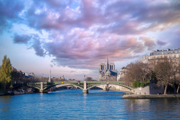 Paris, the Sully bridge on the Seine, and the Notre-Dame cathedral in background