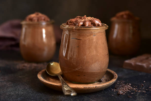 istock Delicious chocolate mousse in a vintage jars. 1731362104