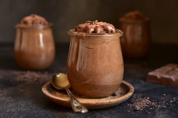 istock Delicious chocolate mousse in a vintage jars. 1731362148