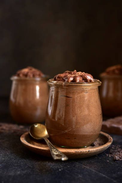 istock Delicious chocolate mousse in a vintage jars. 1731362725