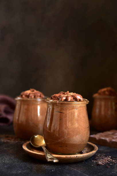 istock Delicious chocolate mousse in a vintage jars. 1731362726
