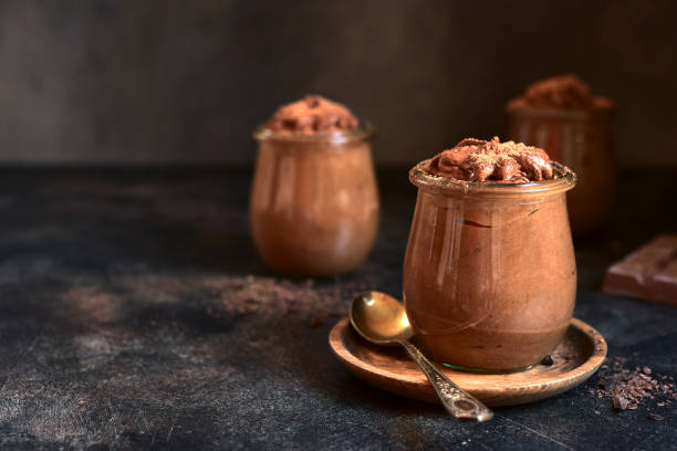 istock Delicious chocolate mousse in a vintage jars. 1731362966