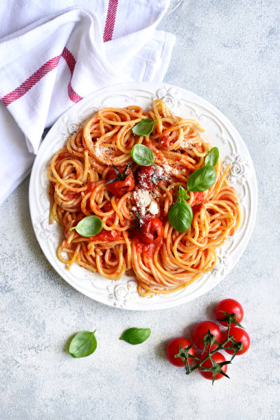 istock Spaghetti with grilled tomatoes. Top view with copy space. 1731370679