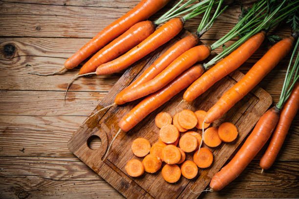 istock Fresh chopped carrots on cutting board. 1731374054