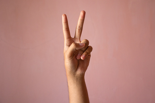 Number Two, Peace, Victory in pink background
