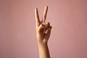 Number Two, Peace, Victory in pink background