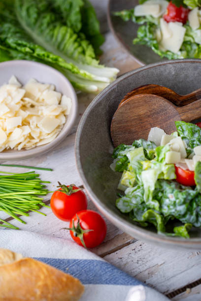 istock Green salad with tomatoes, bread and parmesan cheese 1731418998