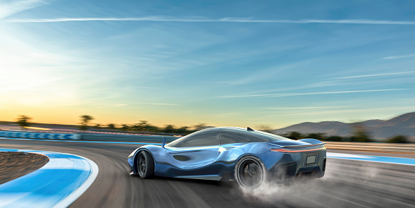 A generic blue electric  sports car moving at high speed around the corner of a racetrack. The vehicle is drifting around the corner, with smoke coming from its spinning rear tires. The racetrack is in a remote location with distant hills. It is sunset/sunrise under a blue sky.