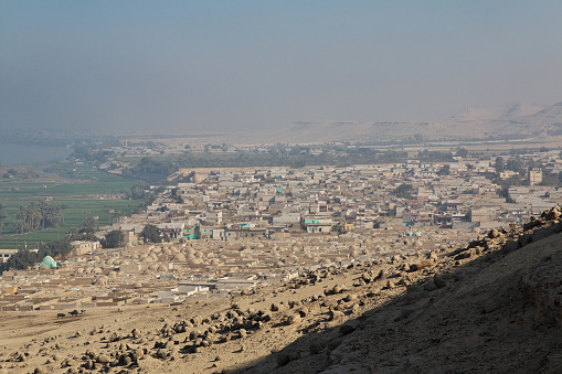 Panorama of unique geological formations in Cappadocia, Turkey. There is a group of tourists looking the scenics of the natural rock formations in Cappadocia.