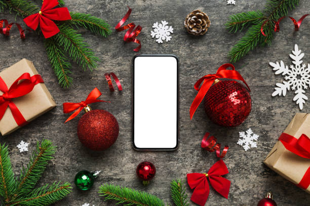 istock Digital phone mock up with rustic Christmas decorations for app presentation top view with empty space for you design. Christmas online shopping concept. Tablet with copy space on colored background 1731465929
