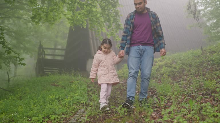 Father and daughter in nature