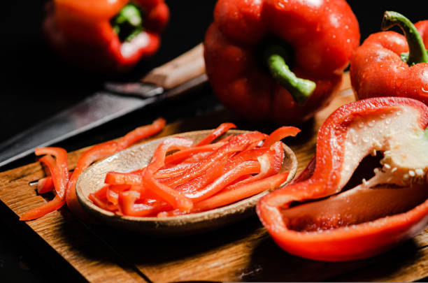 istock Chopped sweet pepper. On black table. 1731472543