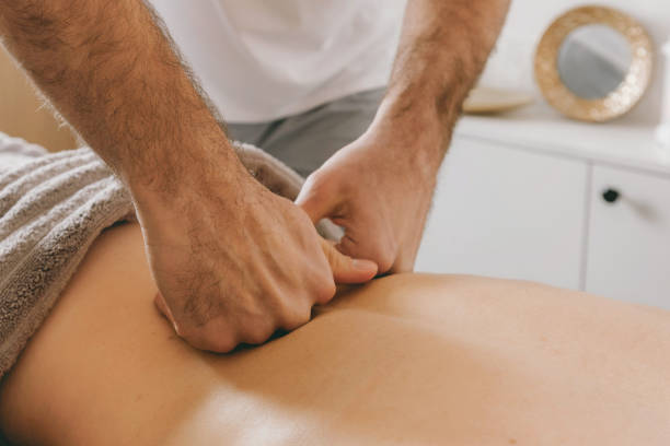 istock Top view close up of massage hands massing female back skillfully 1731483689