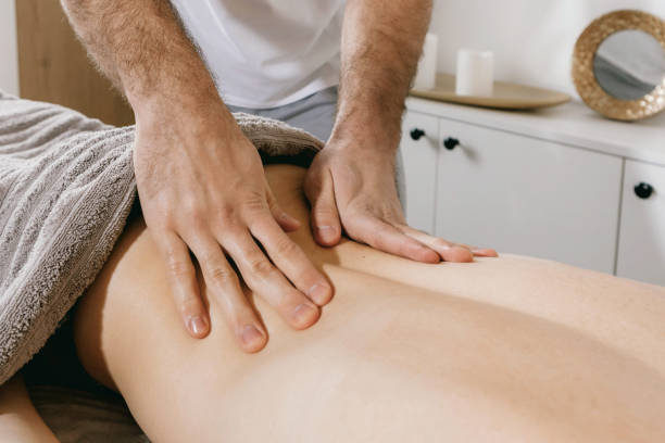istock Top view close up of massage hands massing female back skillfully 1731483692