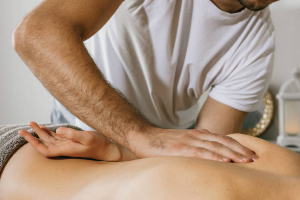 istock Top view close up of massage hands massing female back skillfully 1731484240
