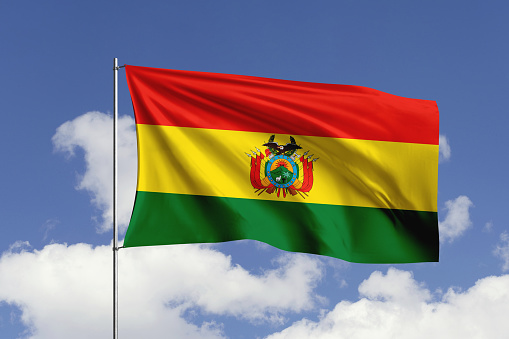 3d illustration flag of Bolivia. Bolivia flag isolated on the blue sky with clipping path.