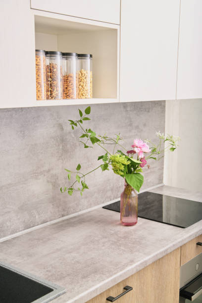 istock gray countertop and splashback, light wood kitchen cabinets 1731484277
