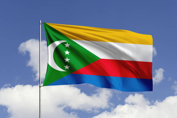 3d illustration flag of Comoros. Comoros flag isolated on the blue sky with clipping path.