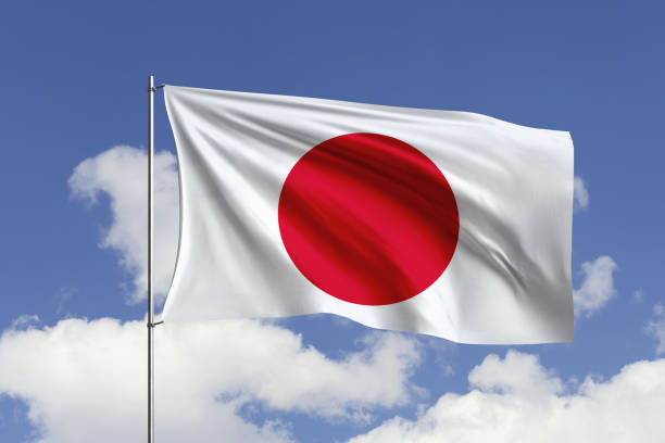 istock Japan flag fluttering in the wind on sky. 1731502889