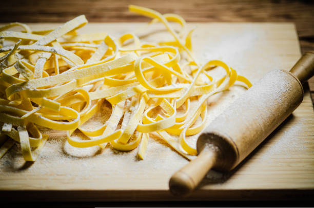 istock Homemade pasta tagliatelle. On wooden table. 1731510341