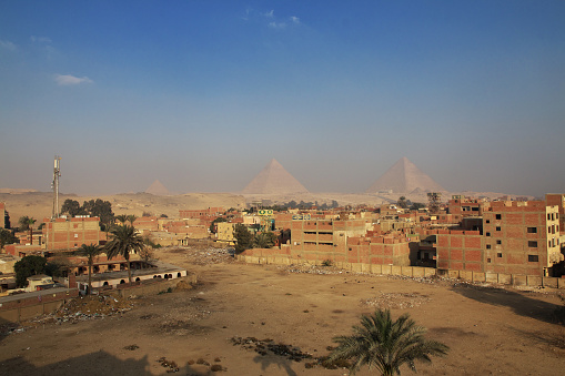 Aerial view of the living quarters of Giza at the background of Pyramids of Egypt