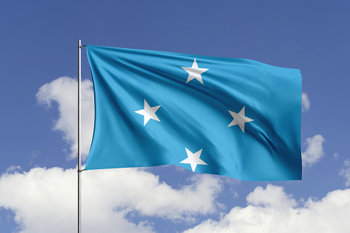 3d illustration flag of Micronesia. Micronesia flag isolated on the blue sky with clipping path.