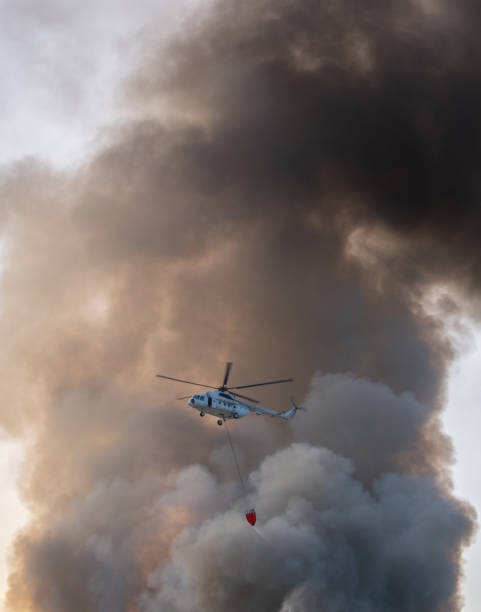 istock Firefighting helicopter performing extinguishing operations 1731533315