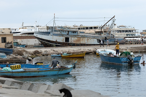 Boats on the water in Qaitbay harbour in Alexandria Egypt