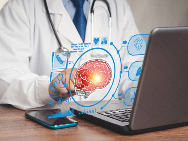 istock Doctor in a uniform read a report brain checkup on a virtual screen while sitting at the table in the hospital 1731551182