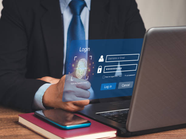 istock Businessman in a suit accesses the system with a fingerprint on the virtual screen 1731552705