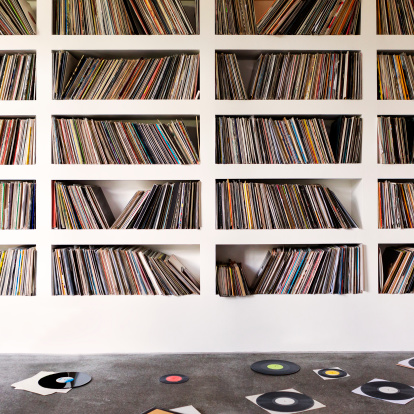 A collection of vinyl records on shelfs.