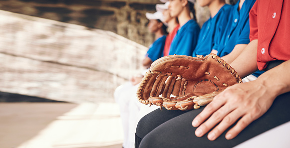 Sports, hand and athlete with a glove for baseball, watching game and team together. Fitness, training and a pitcher or person with gear for a competition, professional contest or ready for a match