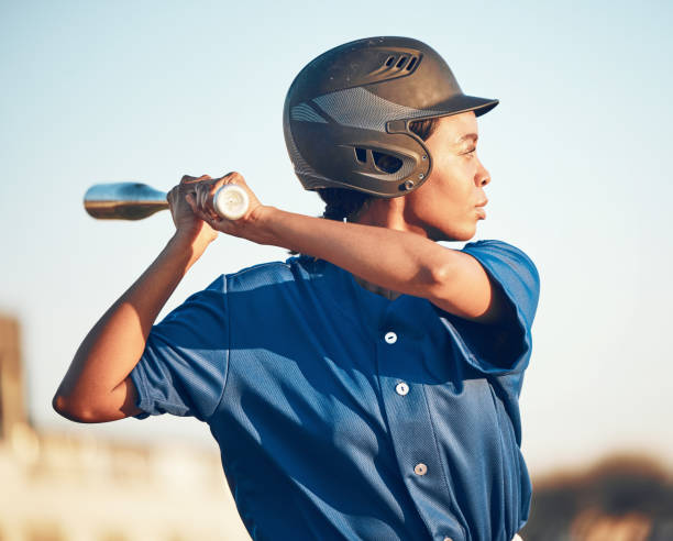 istock Game, baseball player or black woman with a bat, exercise or training with power strike, hit or swing. Person, sports or athlete in club competition, practice match or softball with fitness or health 1731561147