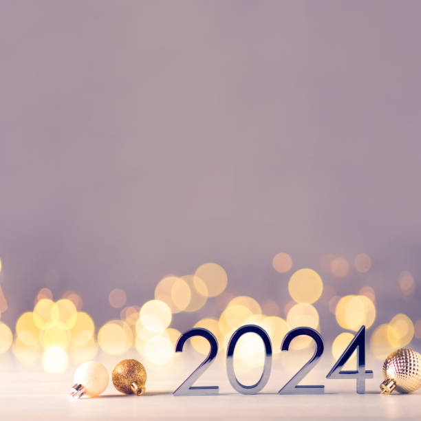 istock Metal numbers 2024 on table with bokeh lights. 1731561715