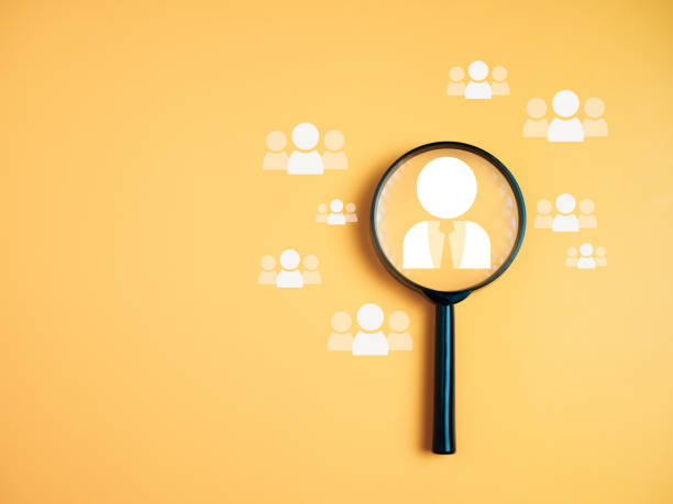 istock Team management concepts, human resources, recruitment concepts, human resource management or human resource management concept, Manager icon in magnifying glass placed on yellow background. 1731565310